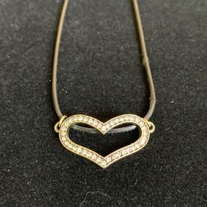 NWOT Cubic zirconia heart pendant on a black leather cord.